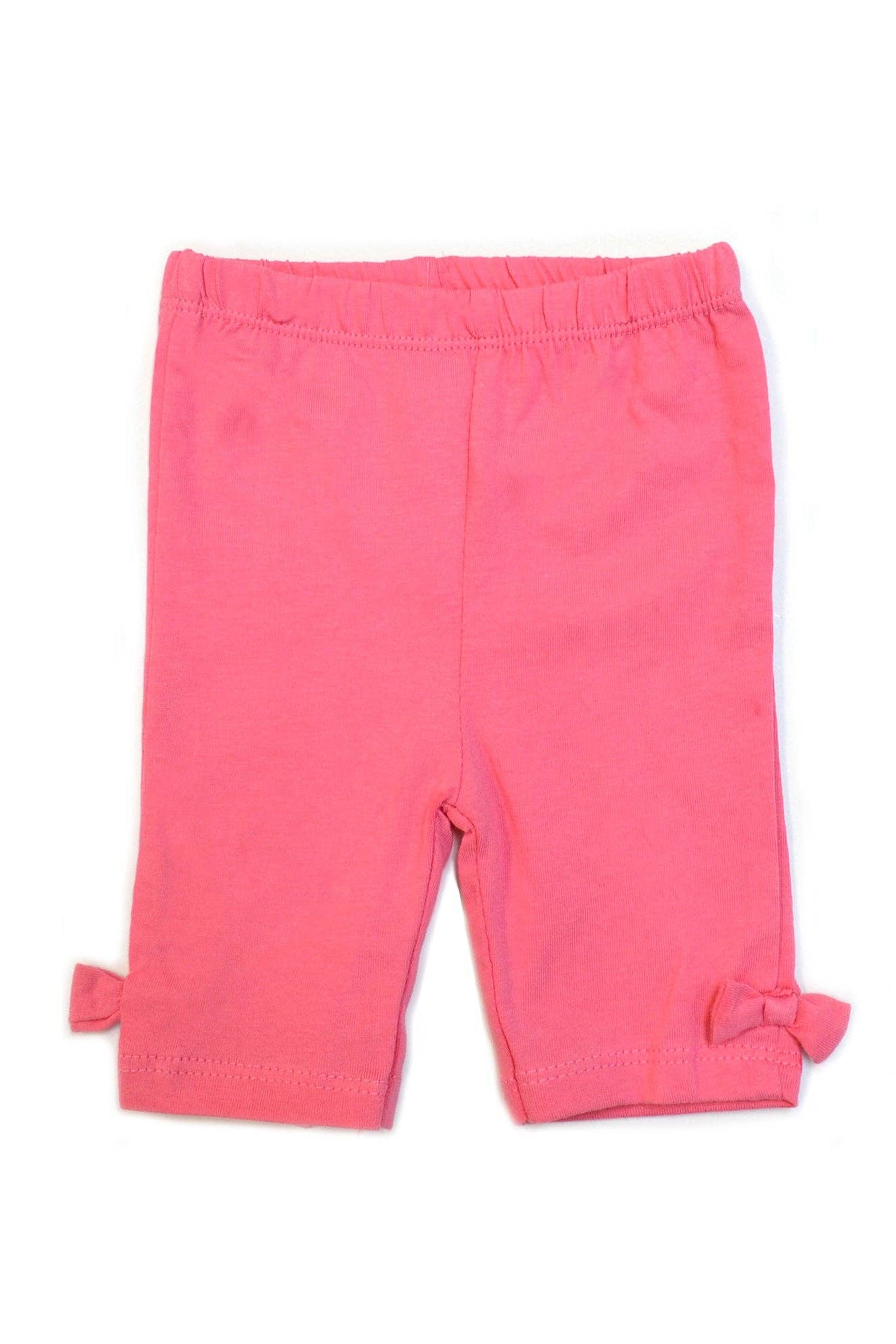 Pink baby leggings with bow details on a white background