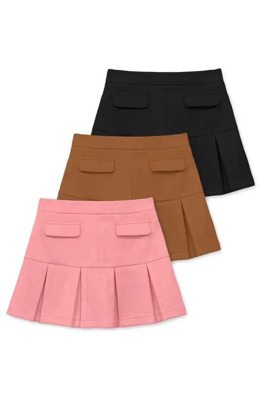 Three pleated skirts in black, brown, and pink on a white background