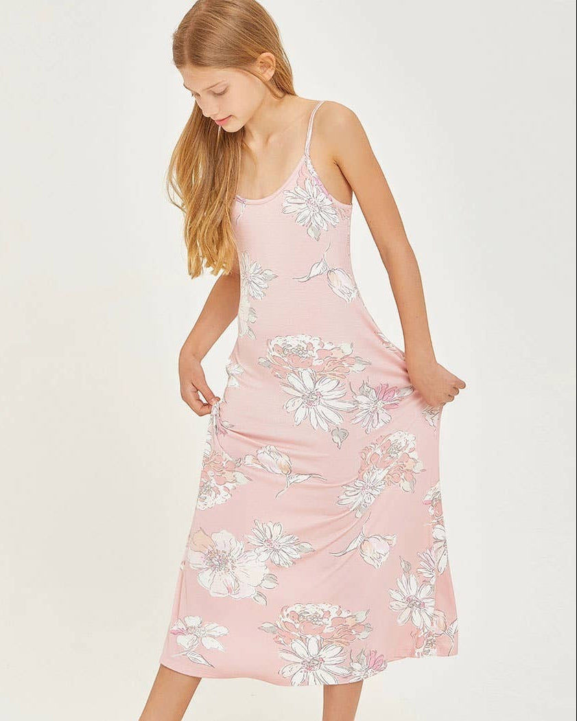 Woman wearing a pink floral dress on a white background