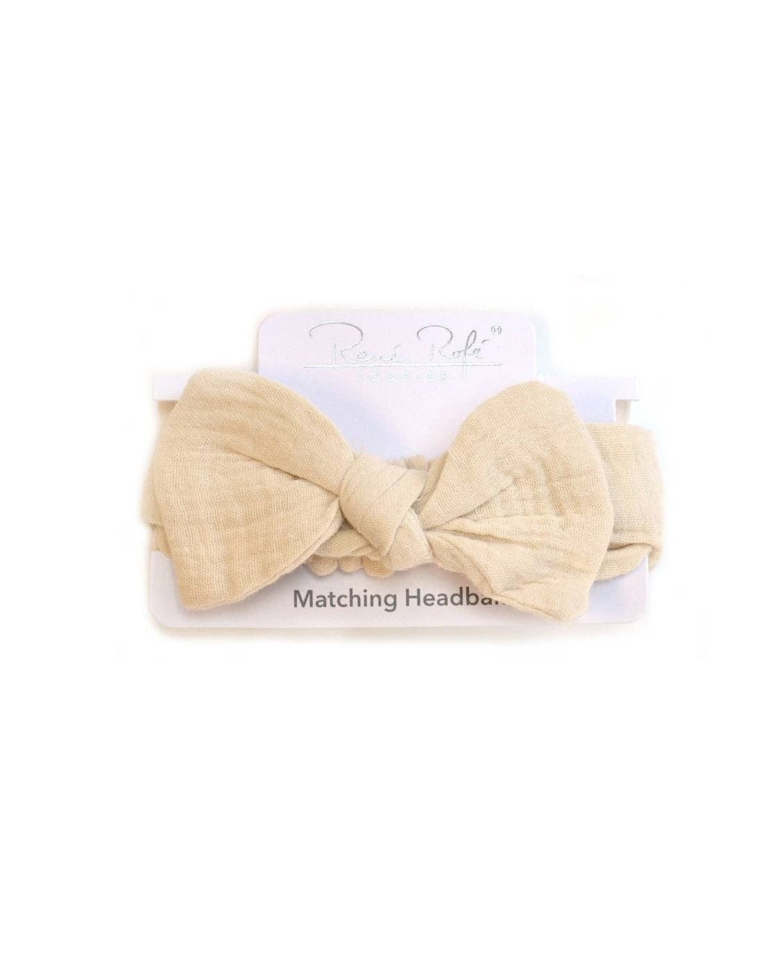 Beige headband with matching bow on a white background