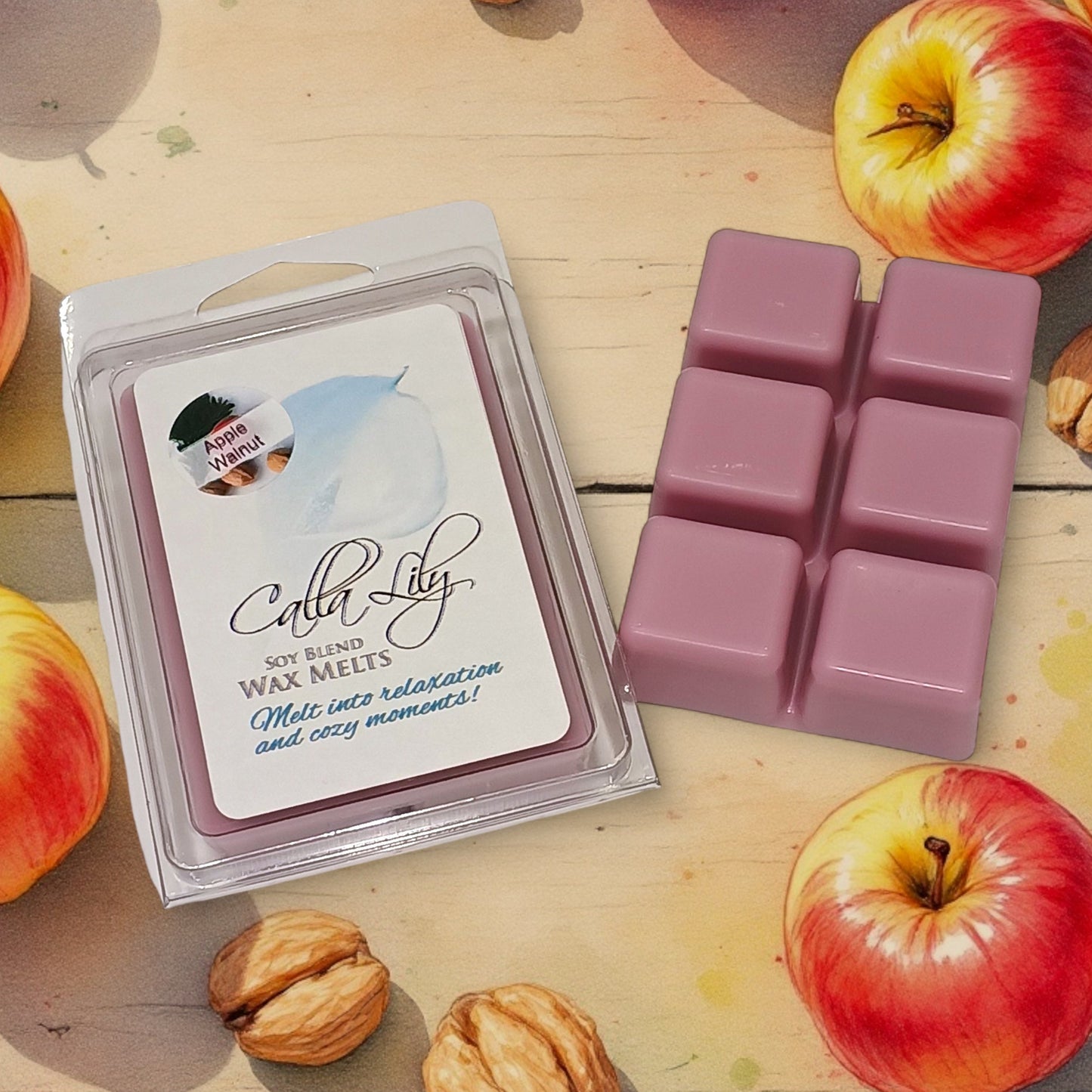 Cala Lily soy blend wax melts packaging with pink wax cubes on a wooden surface with apples and nuts.