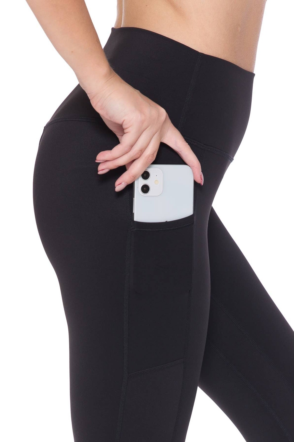 Black leggings with a pocket holding a phone on a white background