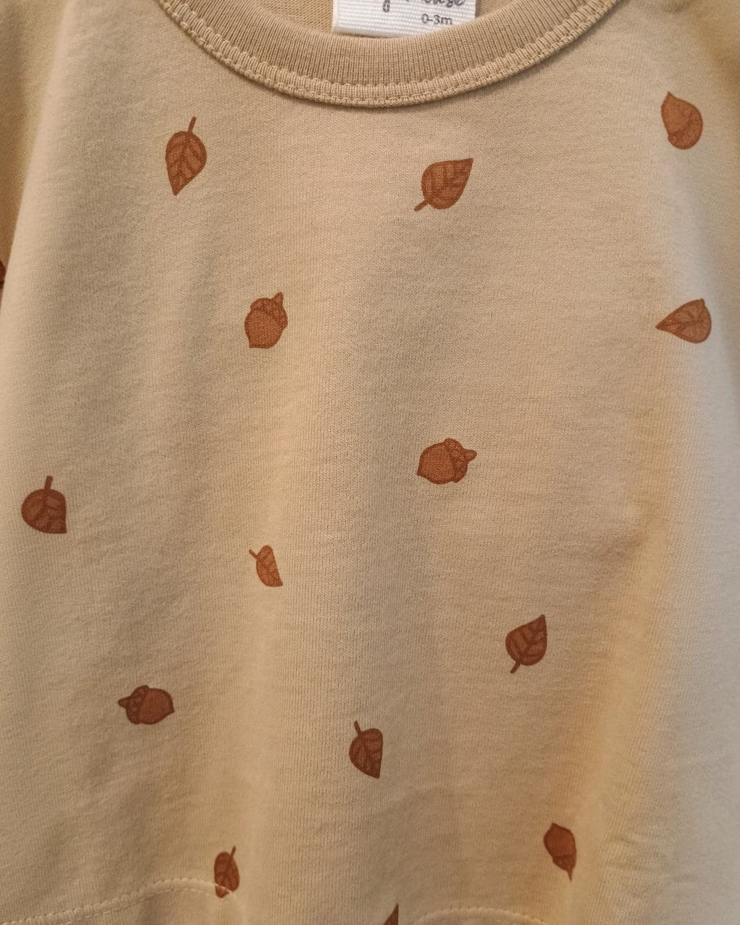 Baby shirt in tan with acorns on it