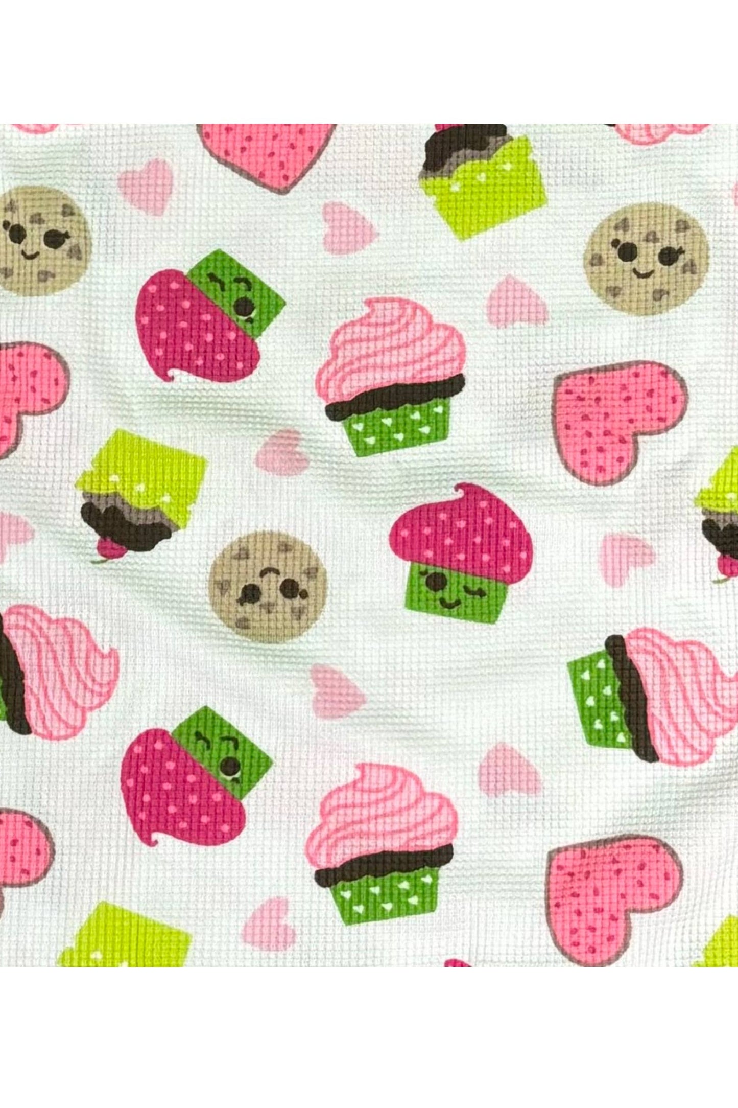 Pattern of colorful cupcakes and cookies on a white background