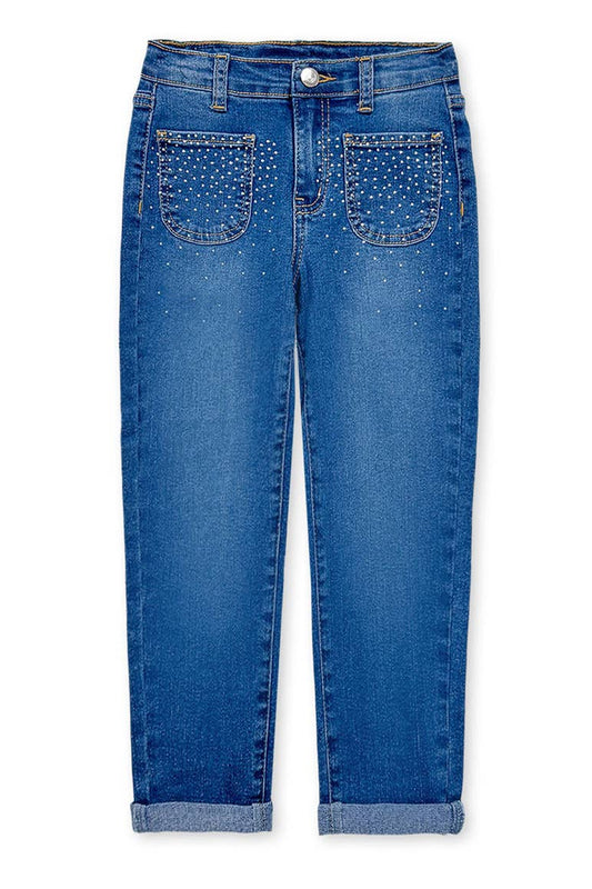 Blue jeans with studded details on a white background