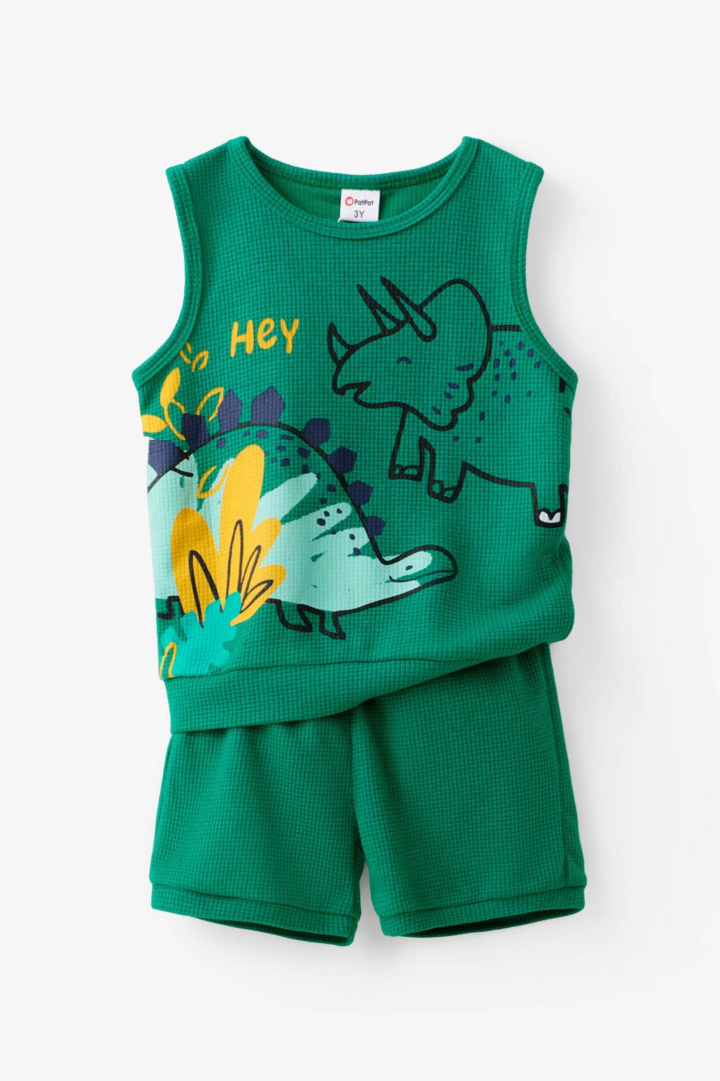 Green children's sleeveless top and shorts set with dinosaur design on a white background