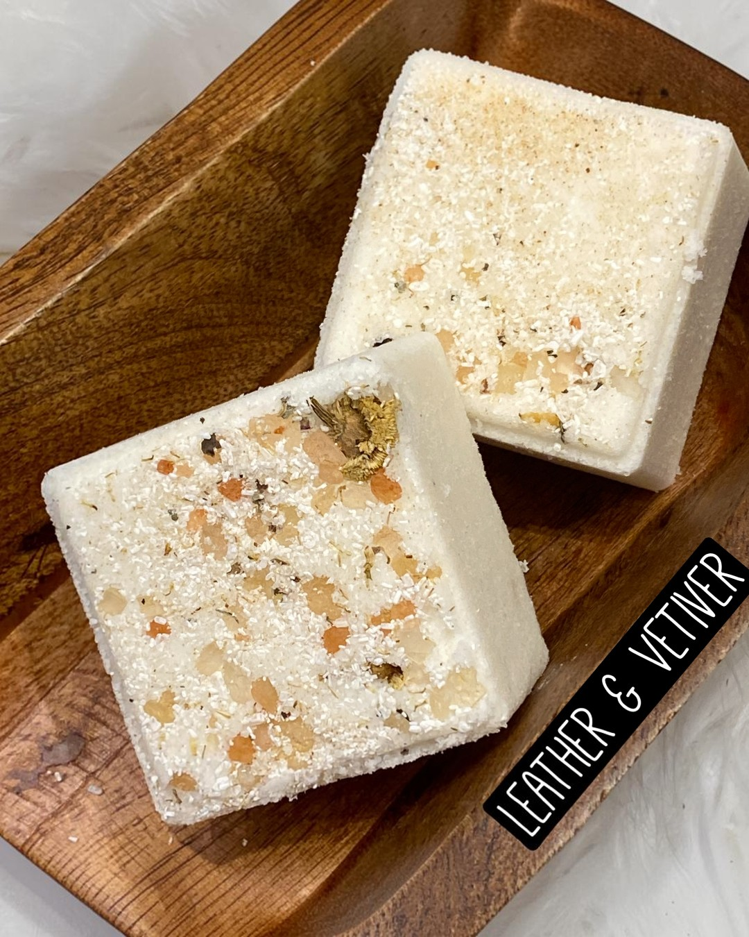 Calla Lily Cosmetics + CL kids square goat milk bath bomb with sea salt and botanicals in a wooden bowl