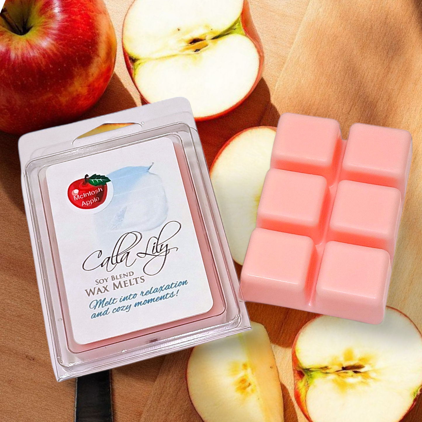 Calla Lily soy blend wax melts with a red apple on a wooden surface
