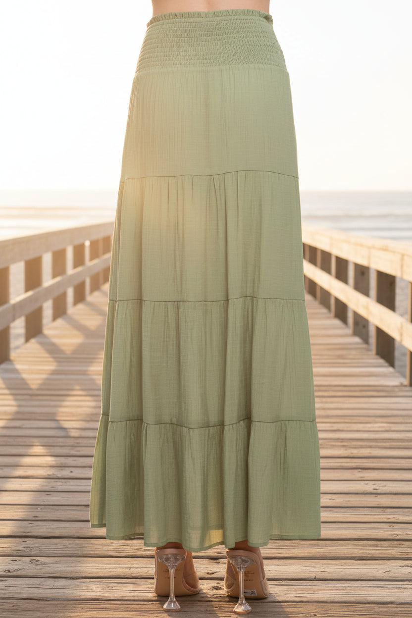 Green tiered skirt on a white background
