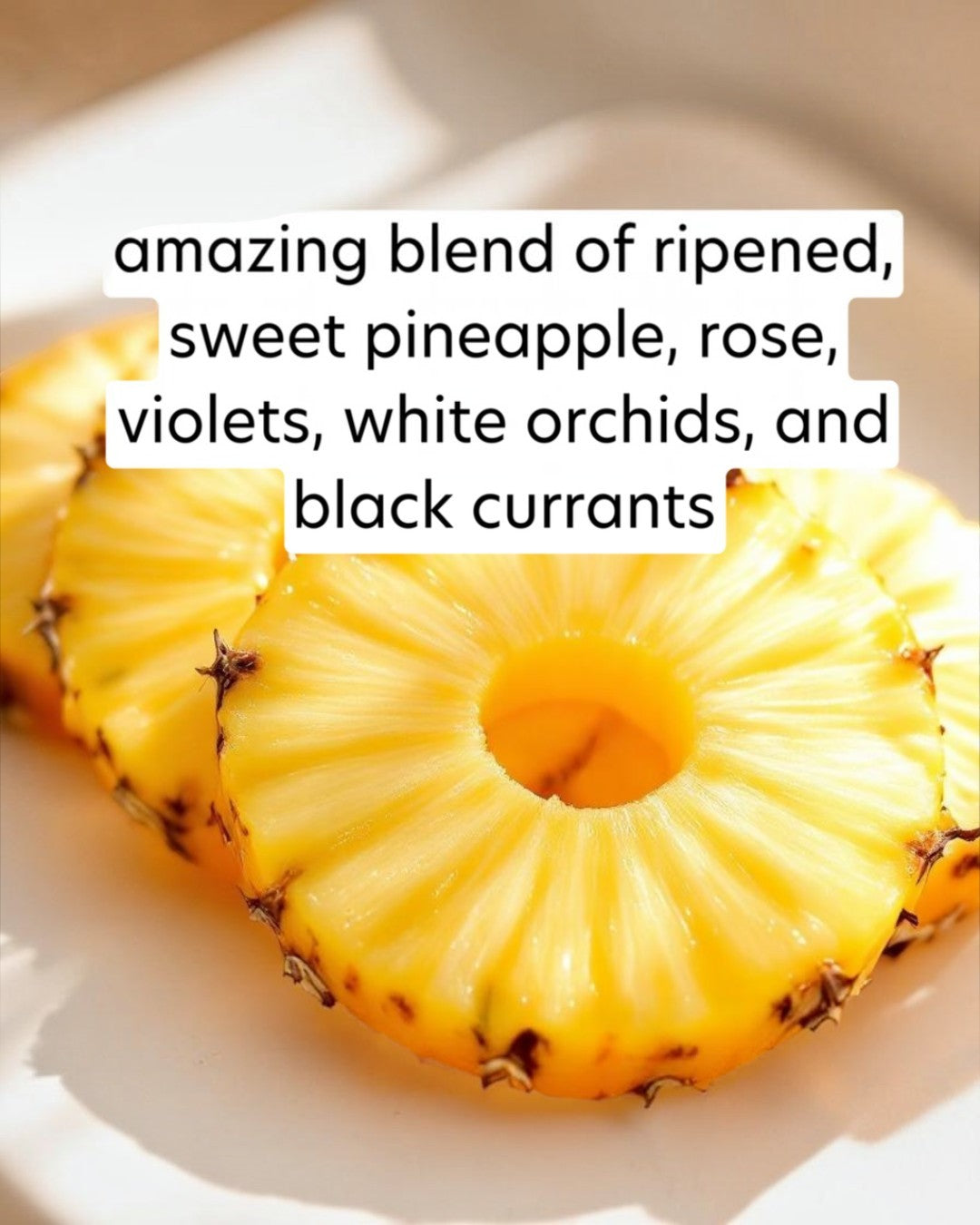 Sliced pineapple on a white plate with descriptive text overlay.