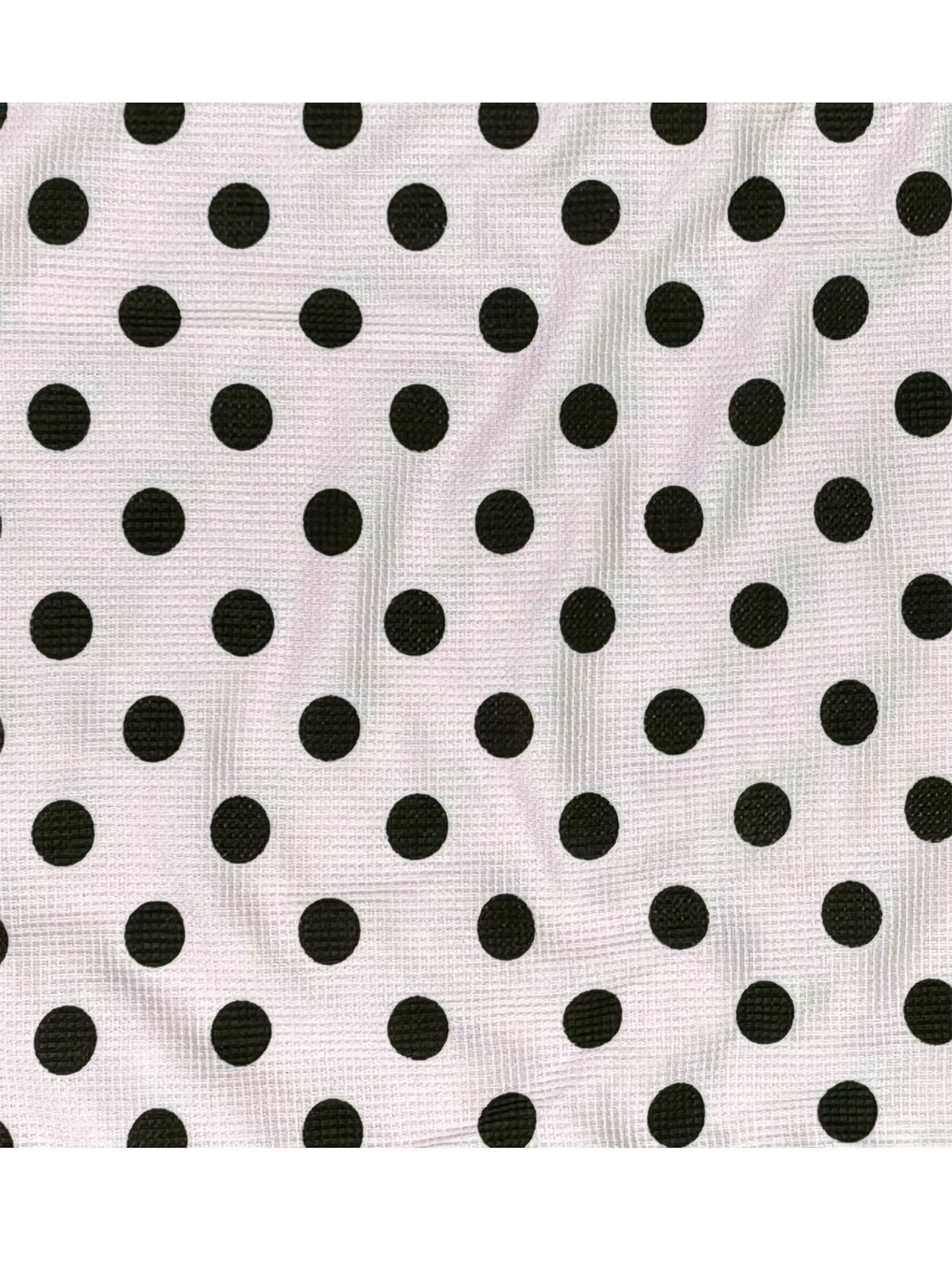 Black polka dots on a white background