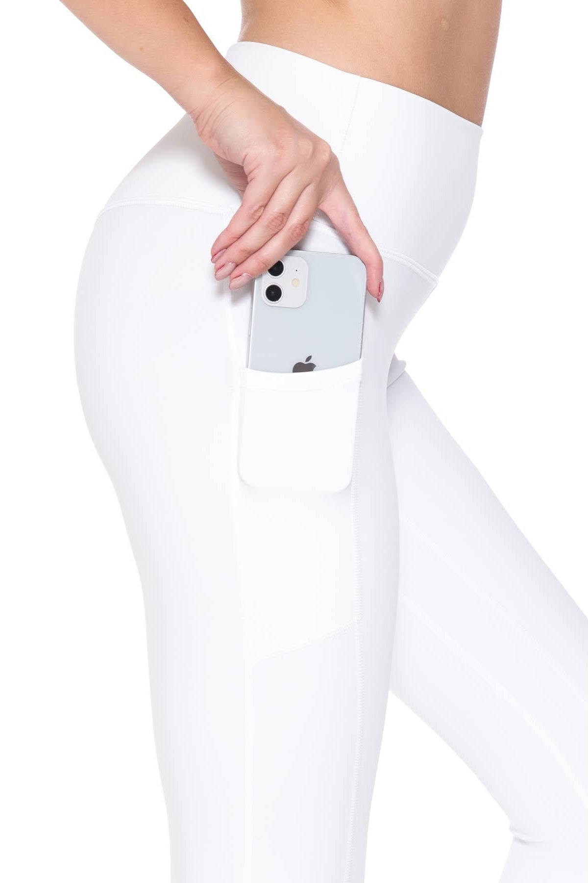 Person wearing white leggings with a phone in the pocket on a white background