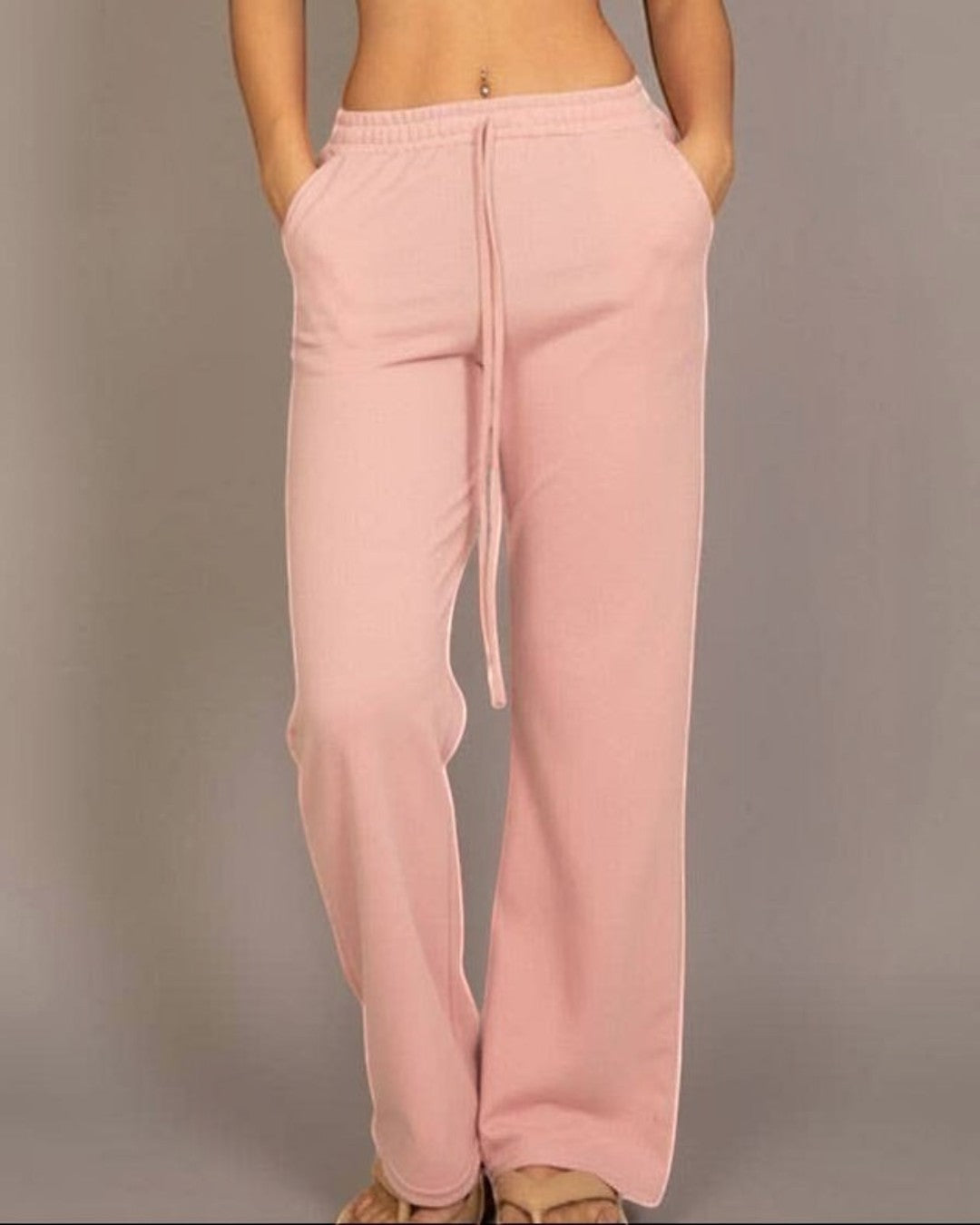 Calla Lily Cosmetics + CL kids pink cotton French terry crop top with elastic hem and wide-leg pants.
