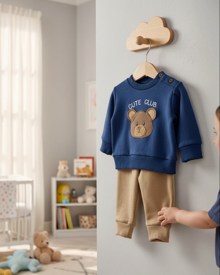 Chick Pea blue cotton blend long-sleeve shirt with "Cute Club" text and bear face, paired with tan joggers.