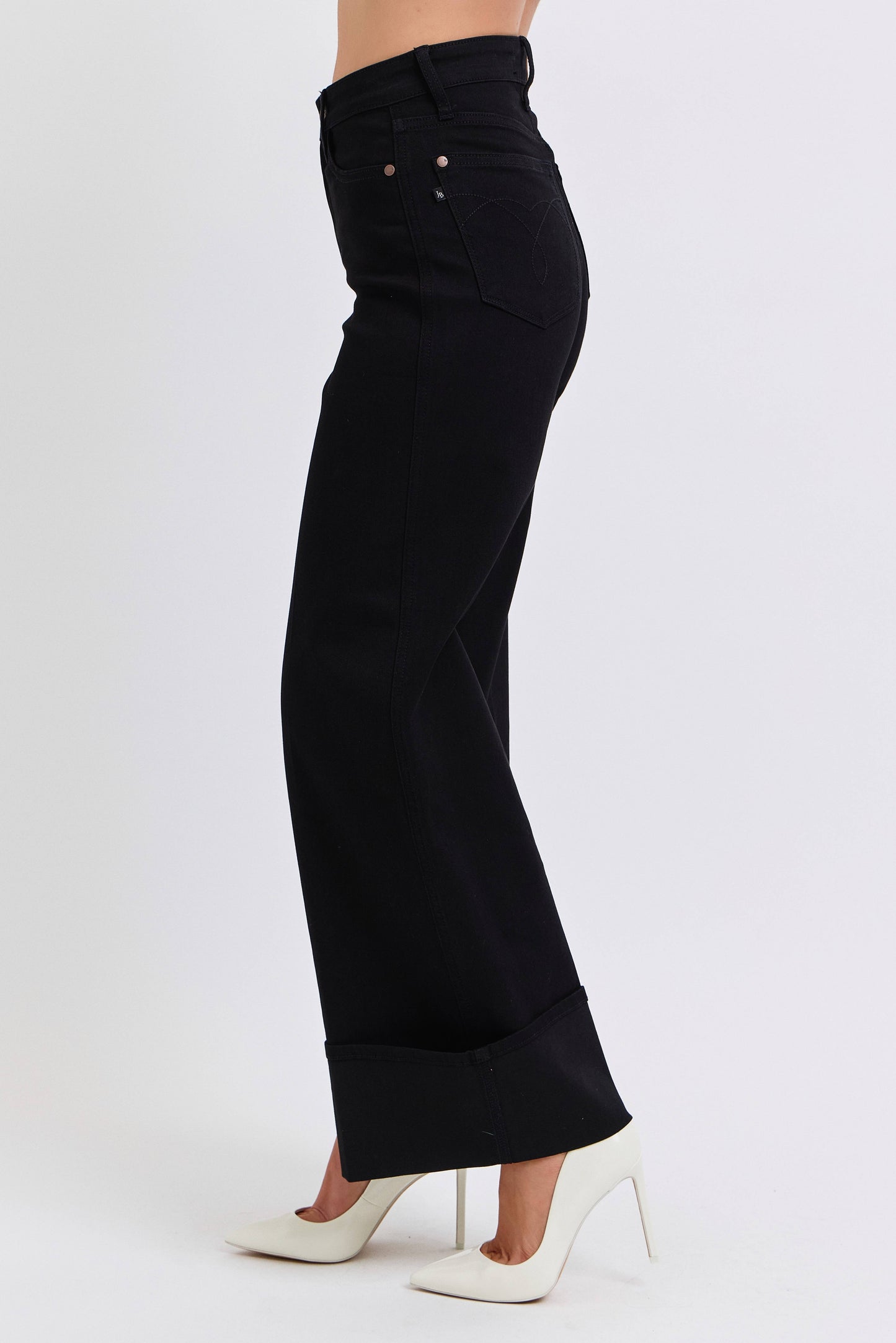Black wide-leg pants worn by a person on a white background