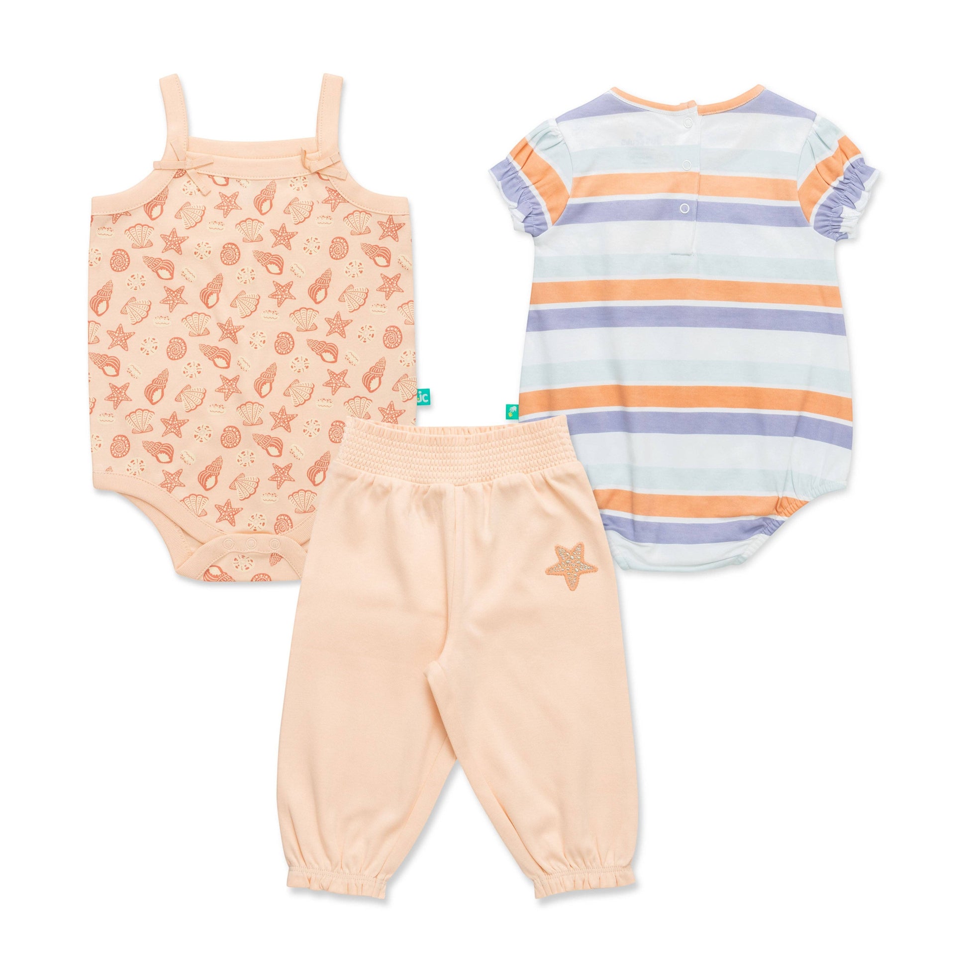 Set of baby clothing including a onesie, tank top, and pants on a white background