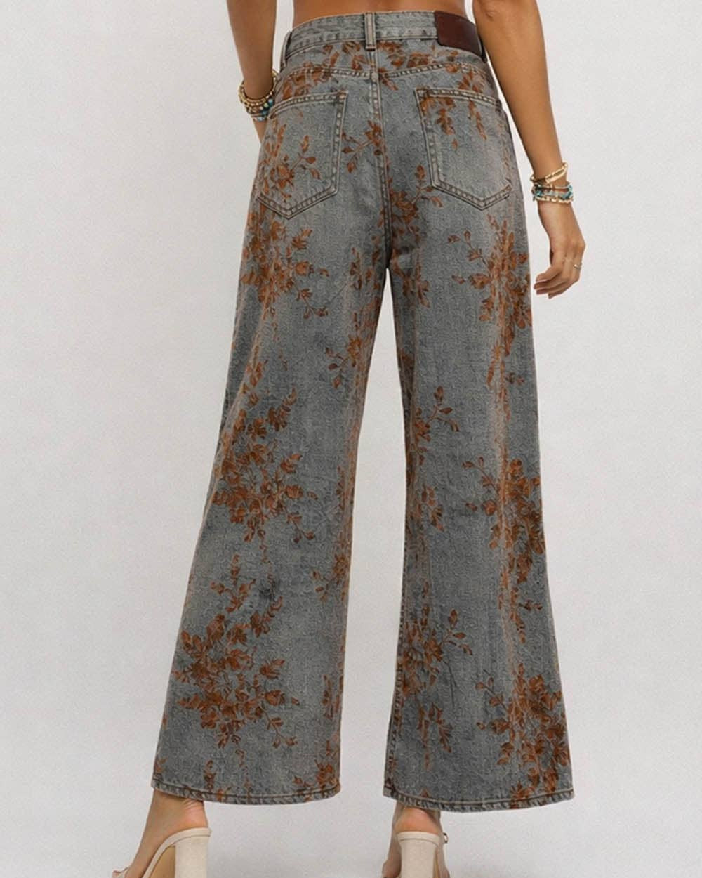 Wide-leg jeans with floral pattern on a white background
