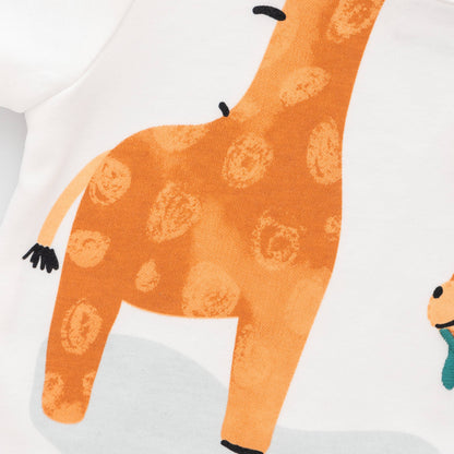 Close-up of a baby outfit with an orange giraffe design on a white background