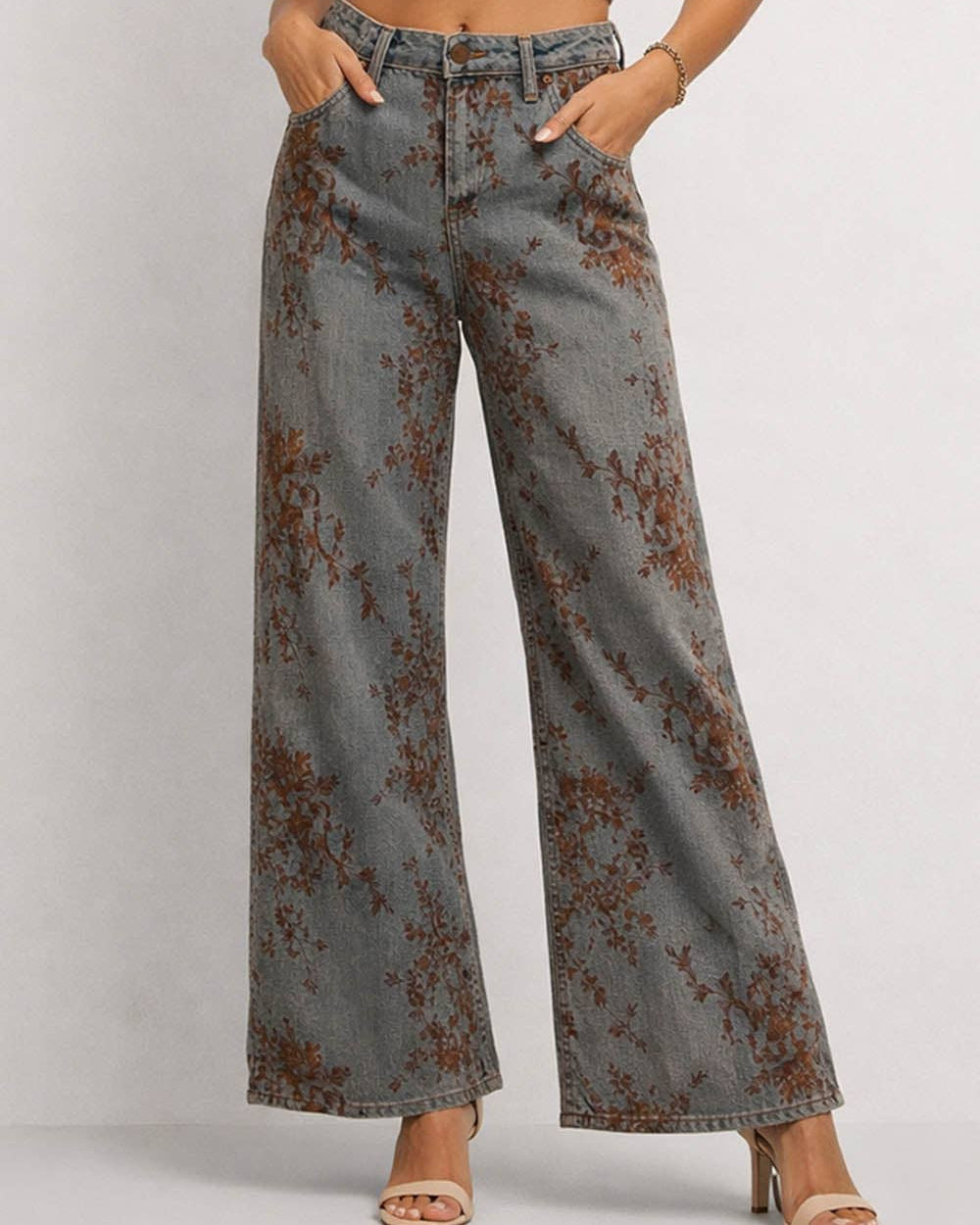Floral patterned wide-leg jeans on a plain background