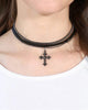 Necklace with a cross pendant worn by a person on a white background