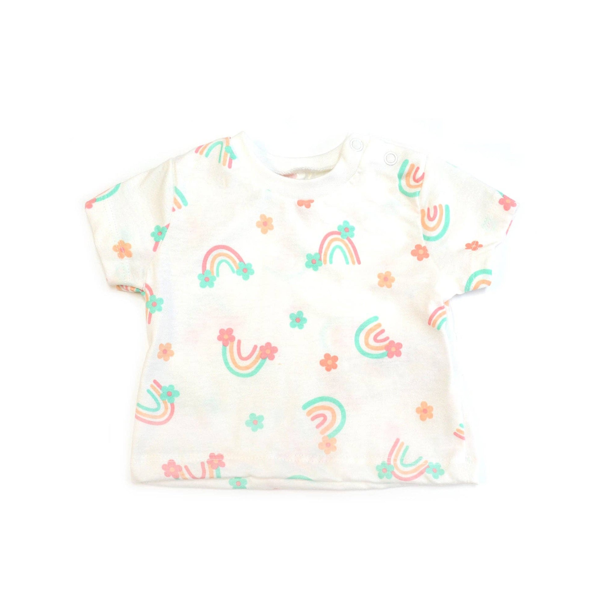 White baby onesie with rainbow and flower patterns on a white background