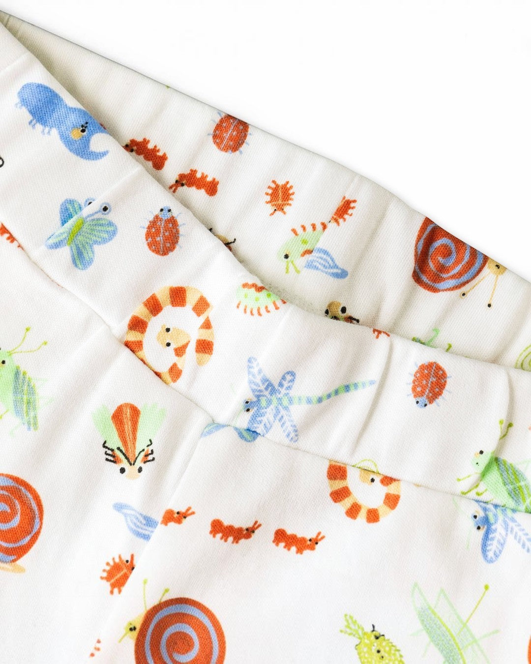 Children's fabric with colorful animal prints on a white background