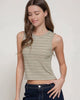 Woman wearing a striped tank top against a plain background