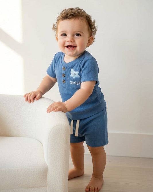 Blue children's outfit with a shirt and shorts on a white background