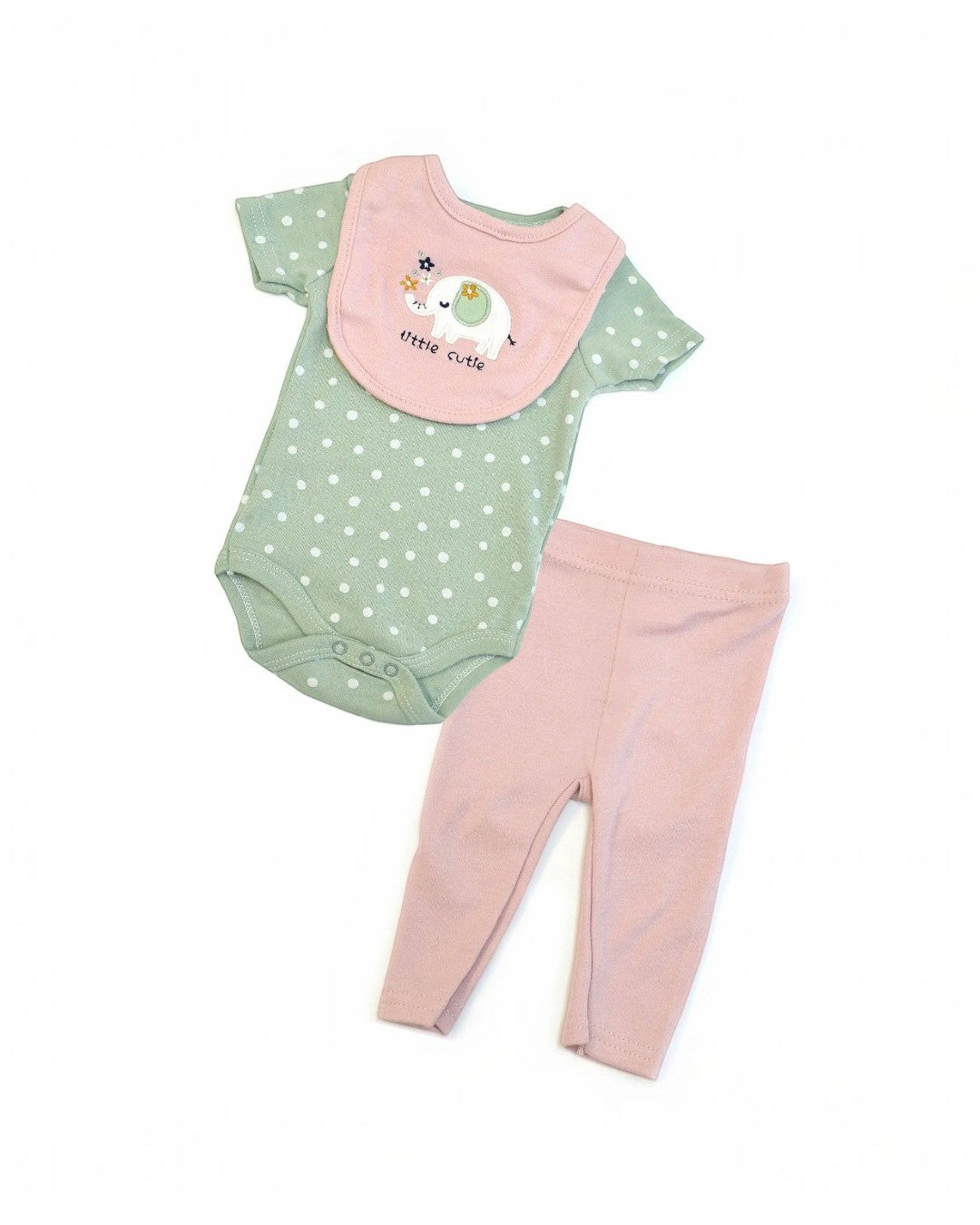 Baby outfit with green polka dot onesie, pink bib, and matching pants on a white background