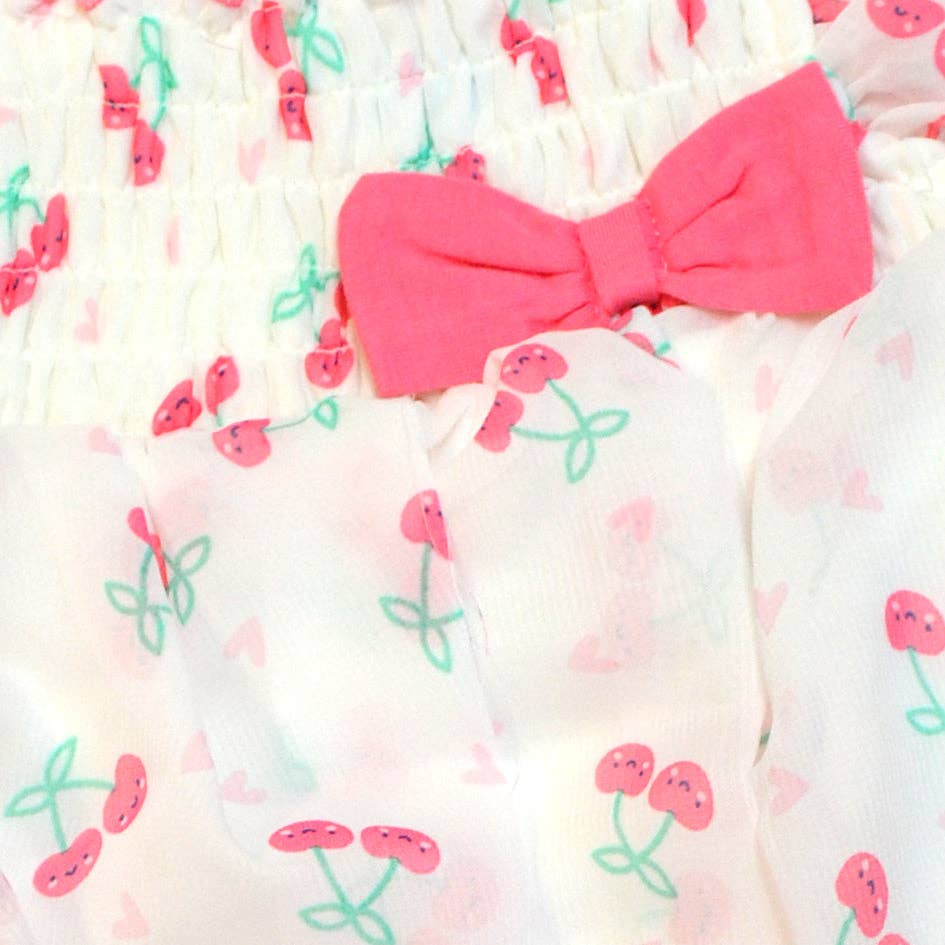 White fabric with pink bow and cherry pattern
