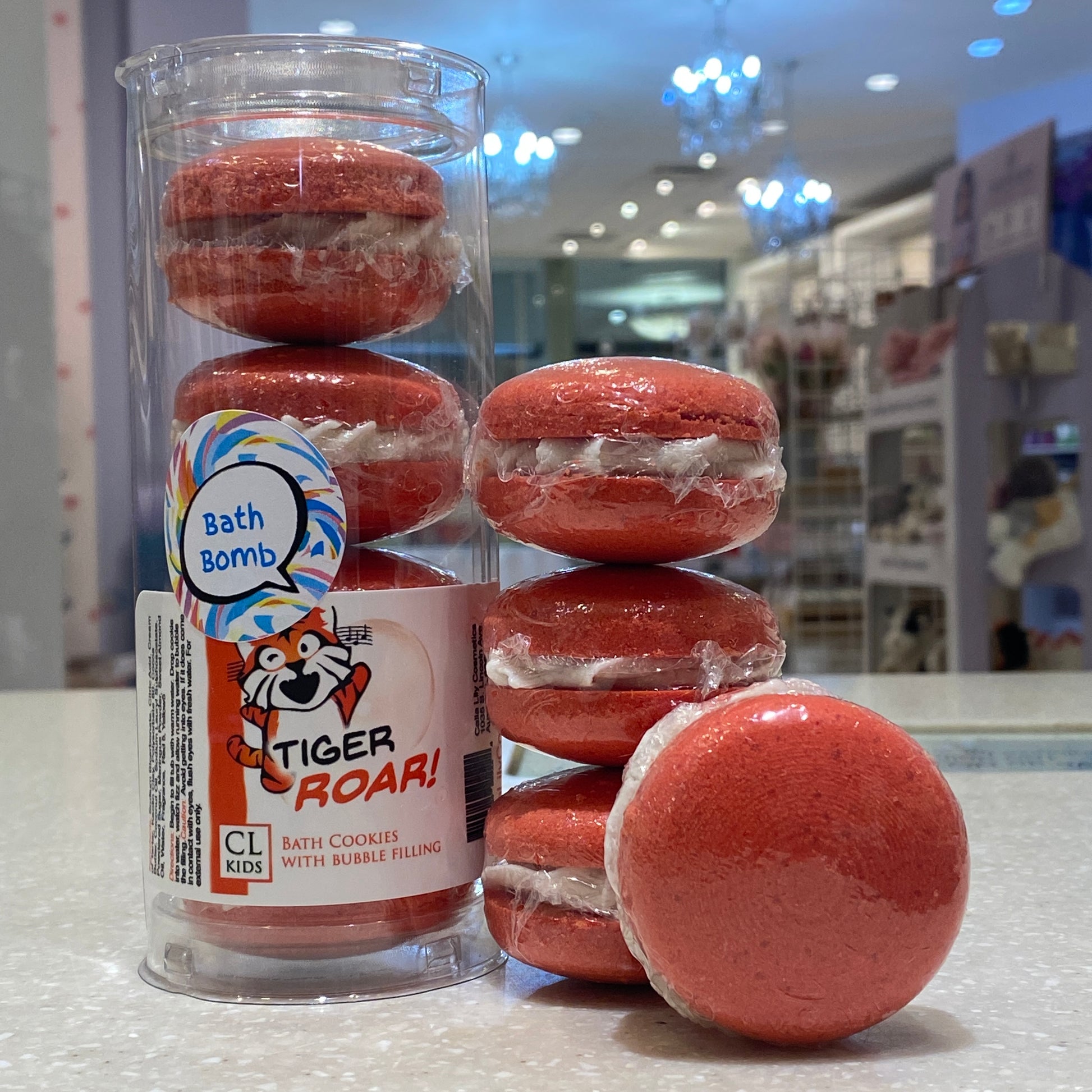 A stack and tube of red orange tigers blood bath cookies on a counter top in our store