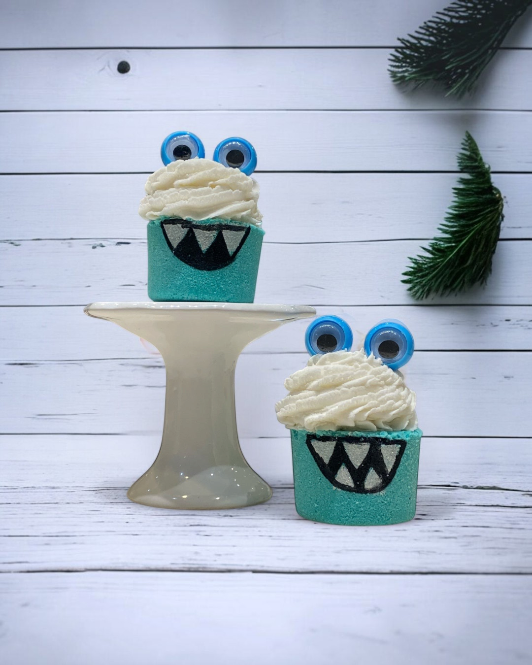 Calla Lily Cosmetics + CL kids teal monster bath bombs shaped like cupcakes with googly eyes and white bubble icing