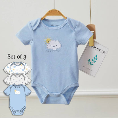 Set of three baby bodysuits with cloud and sun design on a white background