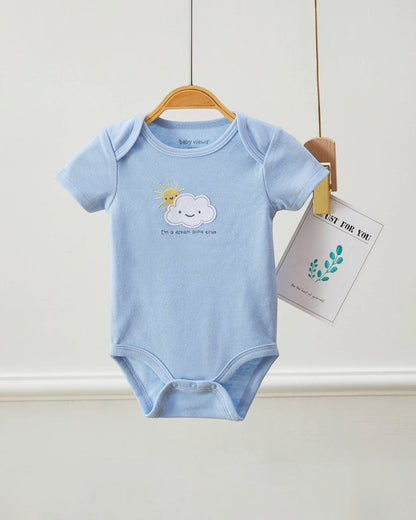 Light blue baby onesie with cloud and sun design on a hanger against a white background