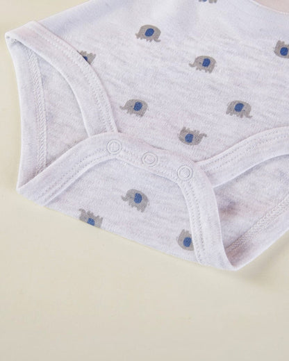 White baby pants with elephant pattern on a beige background