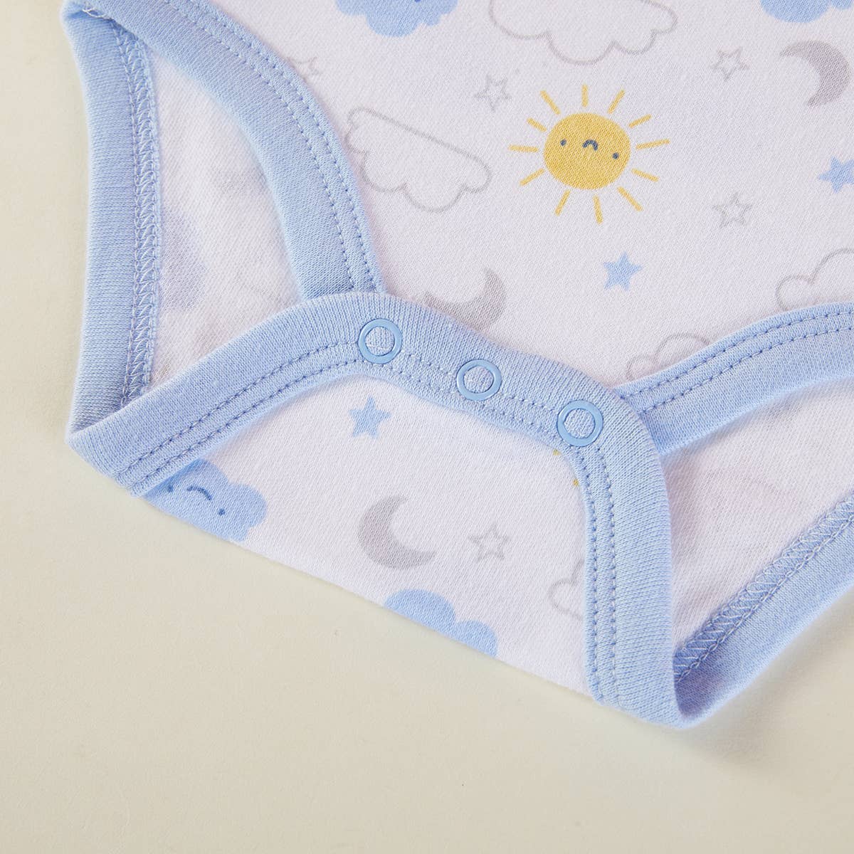 Baby underwear with blue waistband on a light background