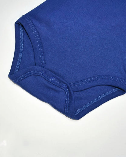 Close-up of a blue baby onesie on a white background