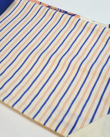 Close-up of fabric with blue and orange stripes on a white background