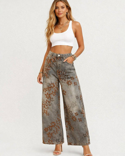 Woman wearing floral wide-leg jeans and a white top on a white background