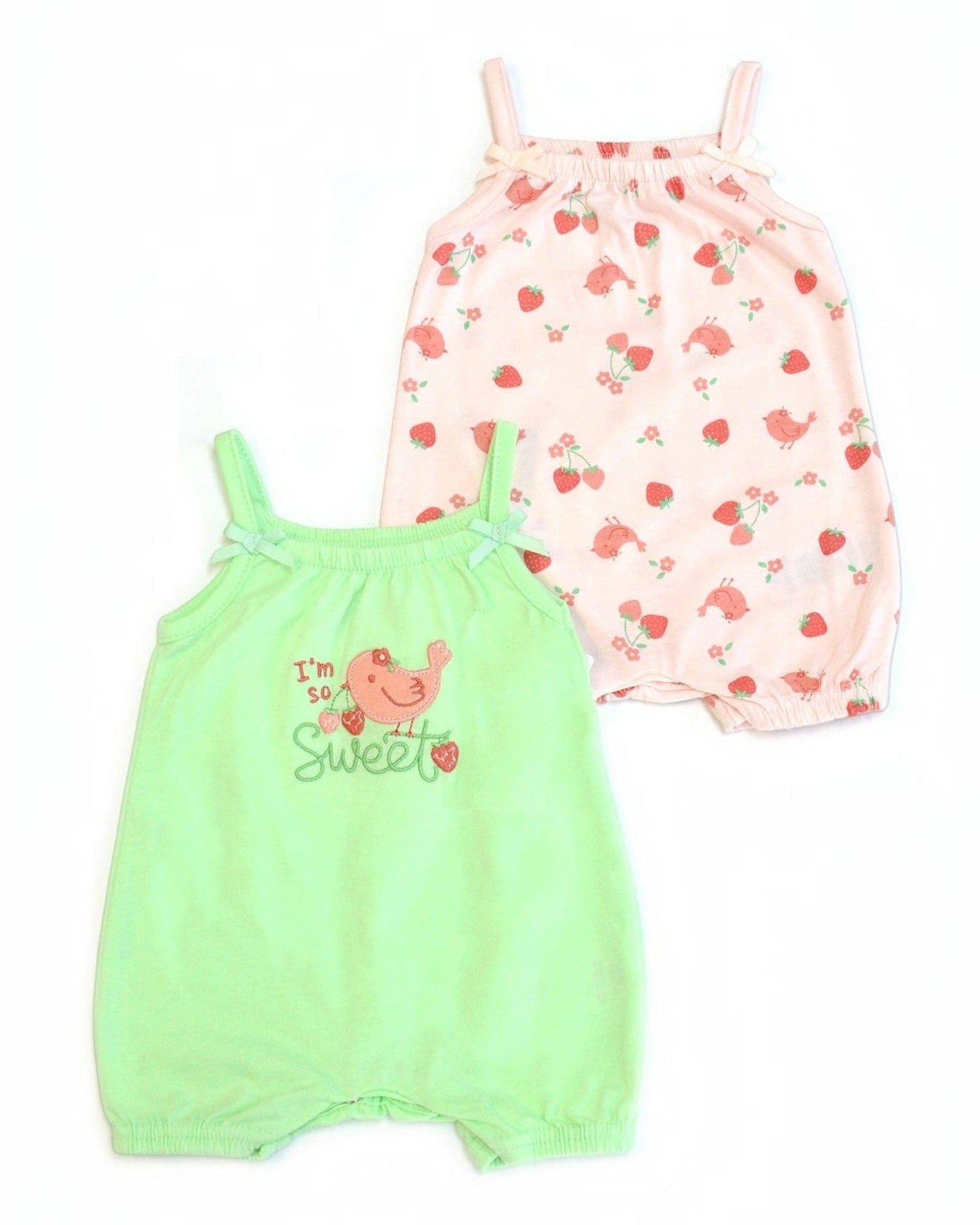 Two baby rompers, one green and one pink with floral pattern, on a white background.