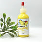 A bottle of our yellow butterfly kisses bath paints against a white background