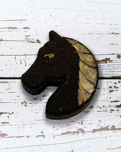 Calla Lily Cosmetics + CL kids horse-shaped bath bomb with dark brown body and shimmering gold mane detail.