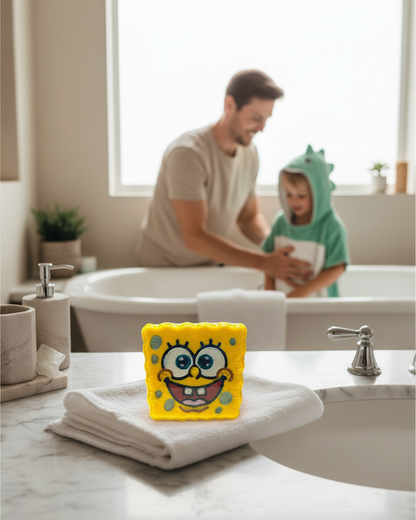 Calla Lily Cosmetics + CL kids handcrafted Sponge Bob bath bomb on a white towel in a bright bathroom