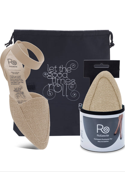 Foot care product set with beige insoles, packaging, and a black bag on a white background.