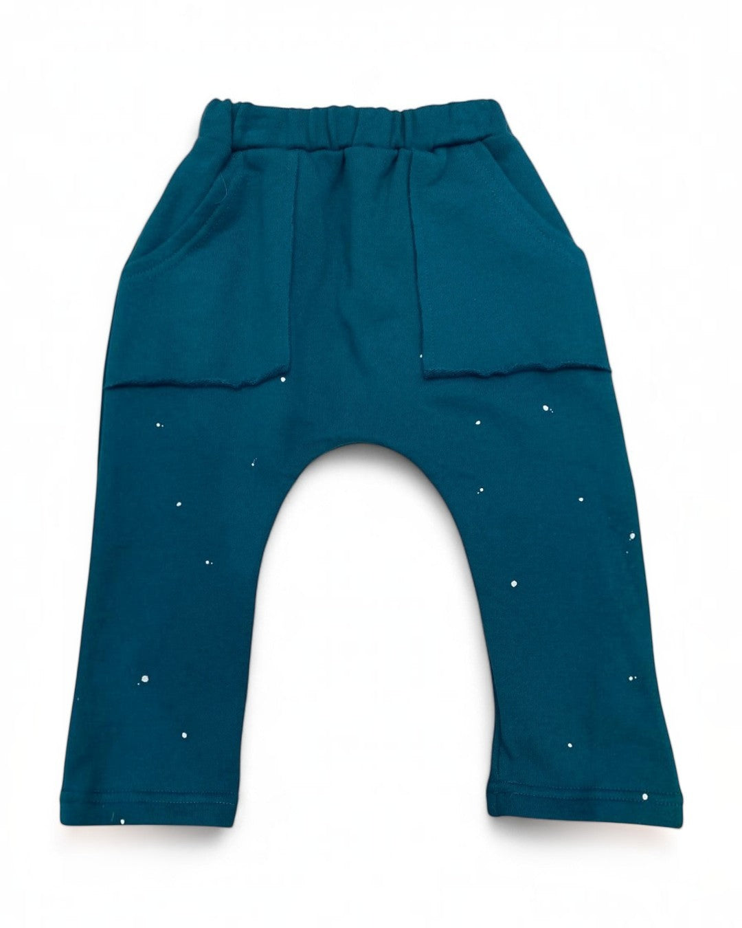 Teal baby pants with star patterns on a white background