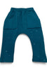 Teal baby pants with star patterns on a white background