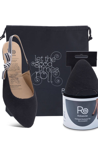 Black shoe with packaging and a container labeled 'Polissole' on a white background