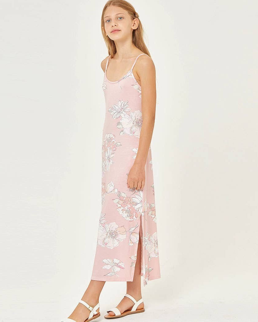 Woman wearing a pink floral dress on a white background