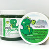 A jar of our green dino burps bubble bath slime agains a white background