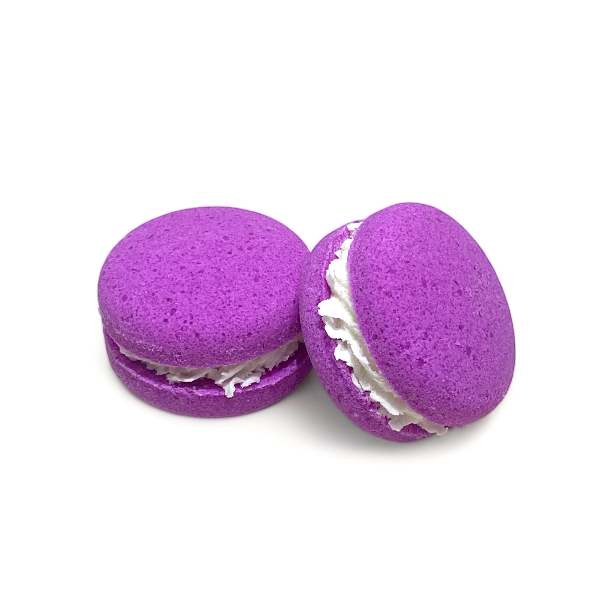 Two purple unicorn yawns bath cookies against a white background